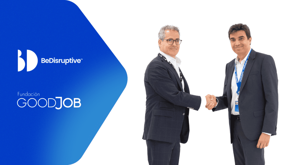 Dos personas firmando un acuerdo de colaboración entre Fundación GoodJob y BeDisruptive para el programa IMPACT#accesibilidad, con los logos de ambas fundaciones y Fundación La Caixa.