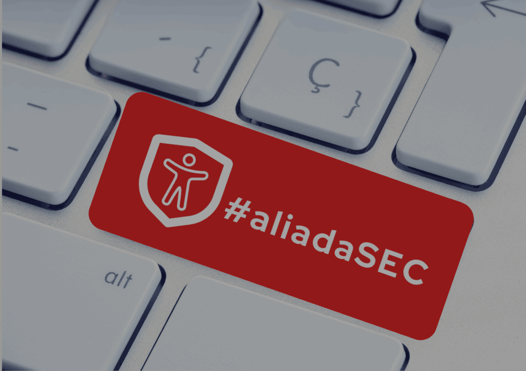 Teclado de un ordenador con una tecla marcada en rojo con el logo de #aliadaSEC.